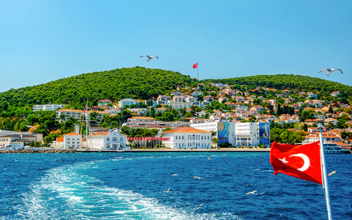 Buyukada Island view from cruise with Turkish flag, Istanbul.