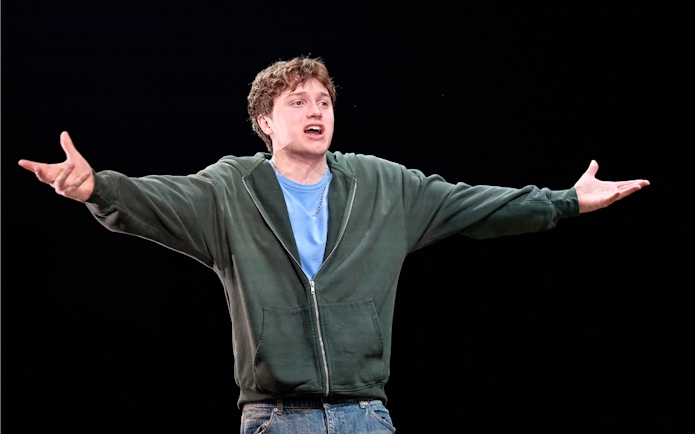 Actor performing on stage in "Inter Alia," West End.