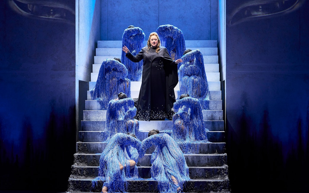 Opera performers in blue costumes on stairs during Turandot show in Sydney.