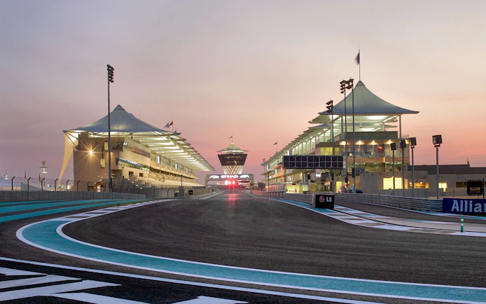 Yas Marina Circuit track view during guided venue tour at sunset.