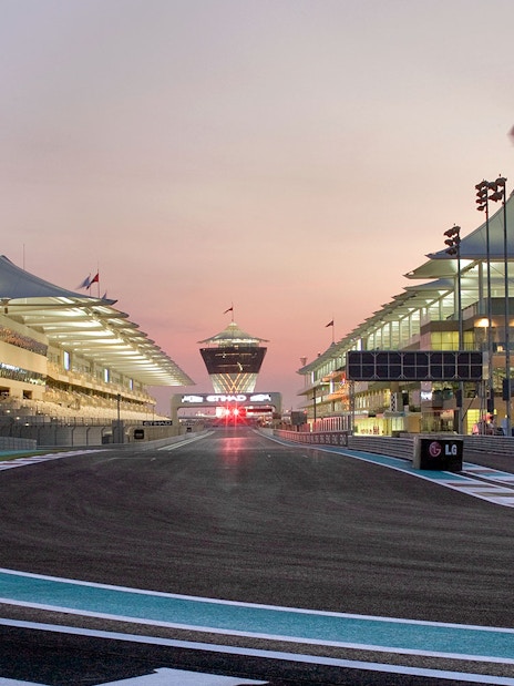 Yas Marina Circuit track view during guided venue tour at sunset.