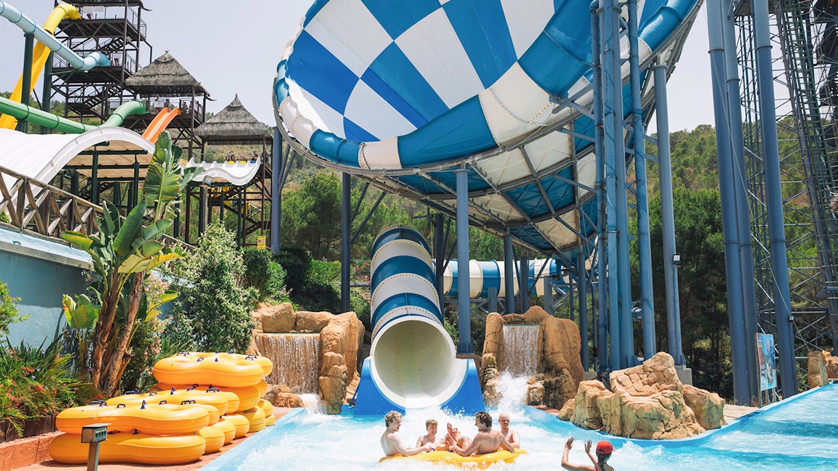 Visitors enjoying the Cyclon water slide at Aqualandia Benidorm.