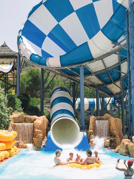 Visitors enjoying the Cyclon water slide at Aqualandia Benidorm.