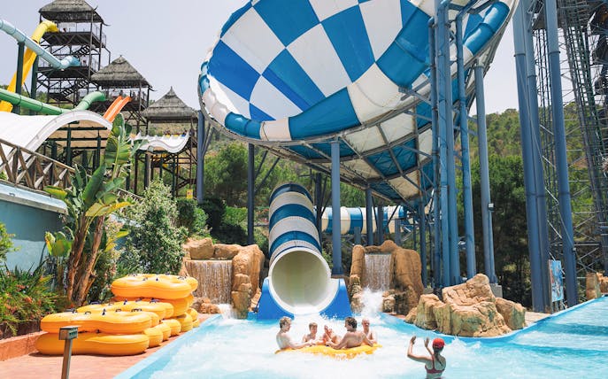 Visitors enjoying the Cyclon water slide at Aqualandia Benidorm.