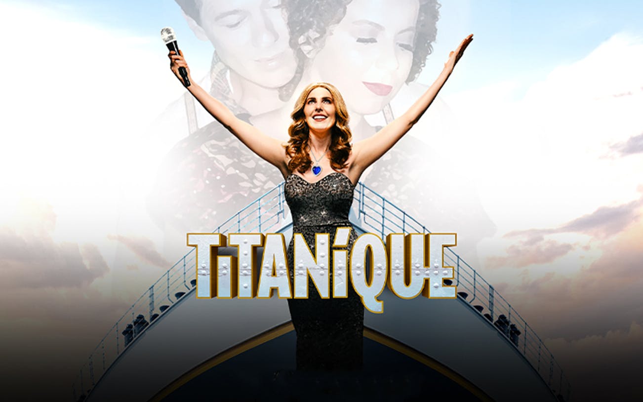 Performer on stage with arms raised, holding a microphone, with "Titanique" text.