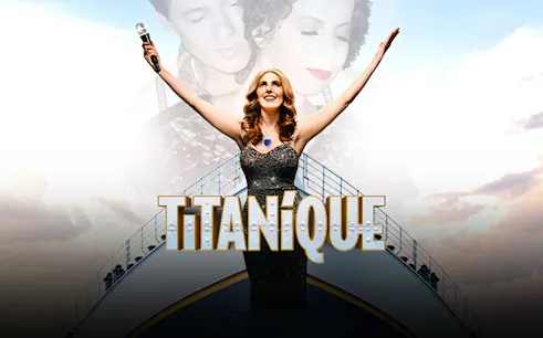 Performer on stage with arms raised, holding a microphone, with "Titanique" text.