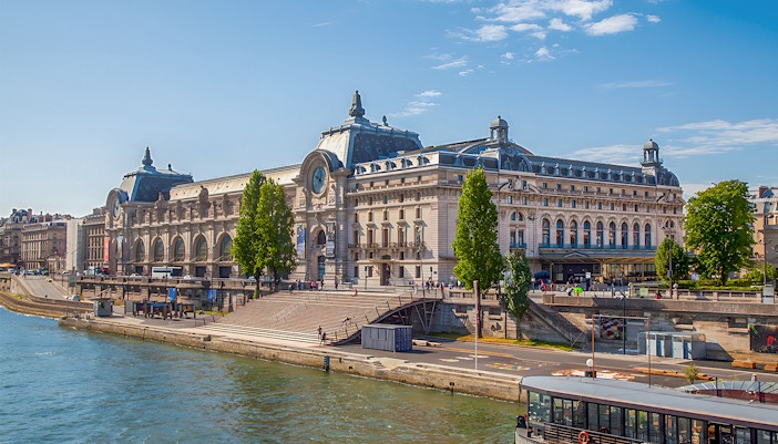 Visitors exploring art at the Orsay Museum in Paris, a unique experience offered in the Combo: 29129 + 6235 tour package