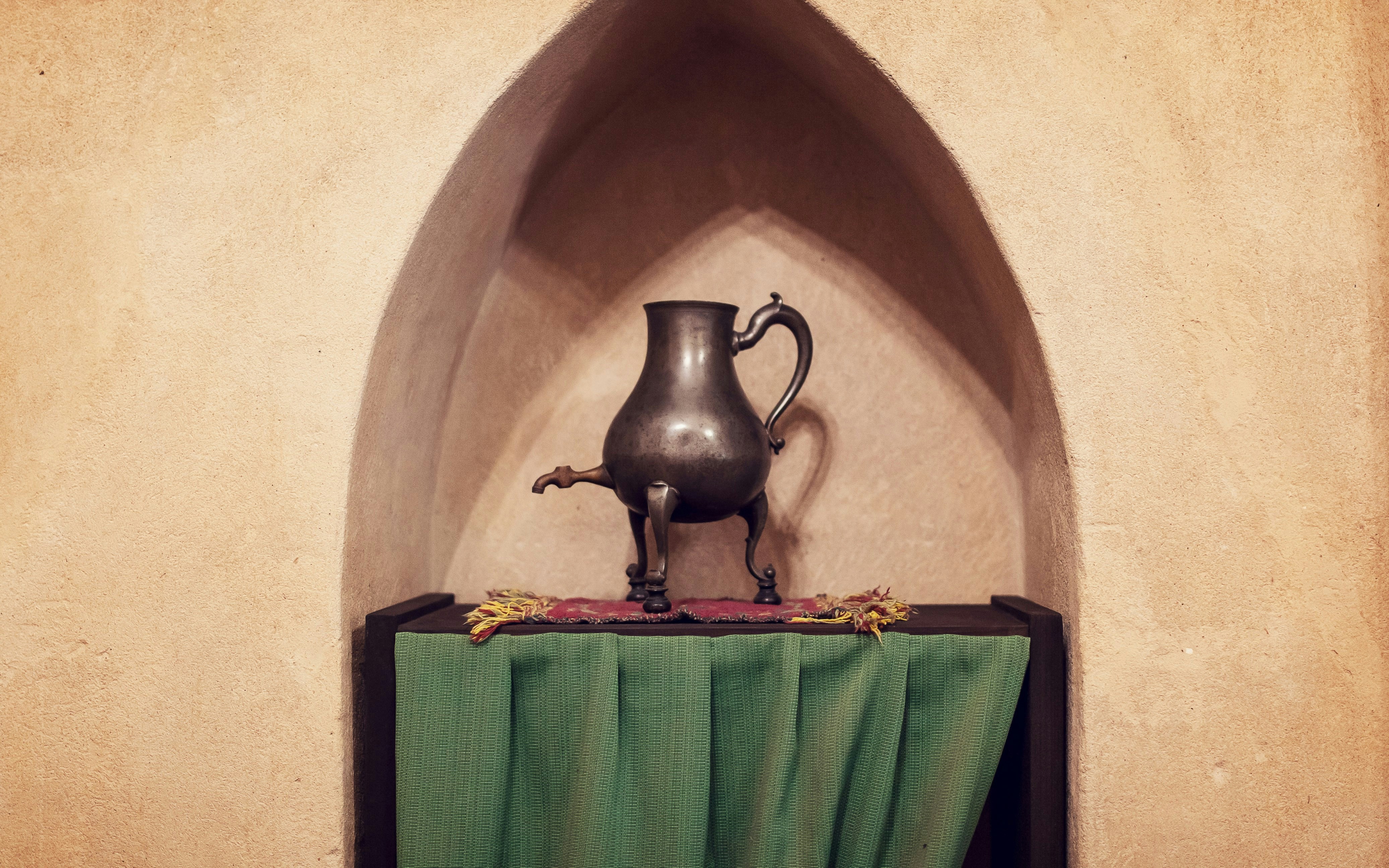 Antique metal jug displayed in a chamber at Malbork Castle, Europe's largest Gothic castle.