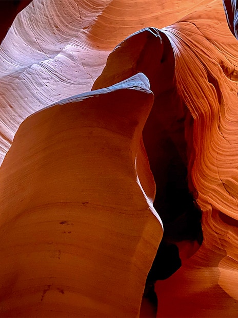 Antelope Canyon X sandstone formations with light filtering through.