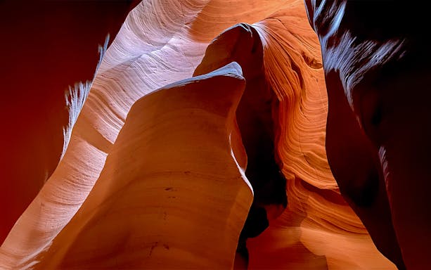 Antelope Canyon X sandstone formations with light filtering through.