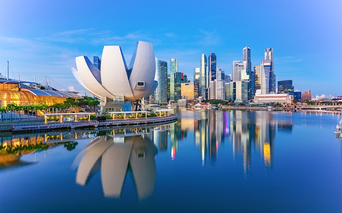 ArtScience Museum with futuristic design by Marina Bay, Singapore skyline in background.