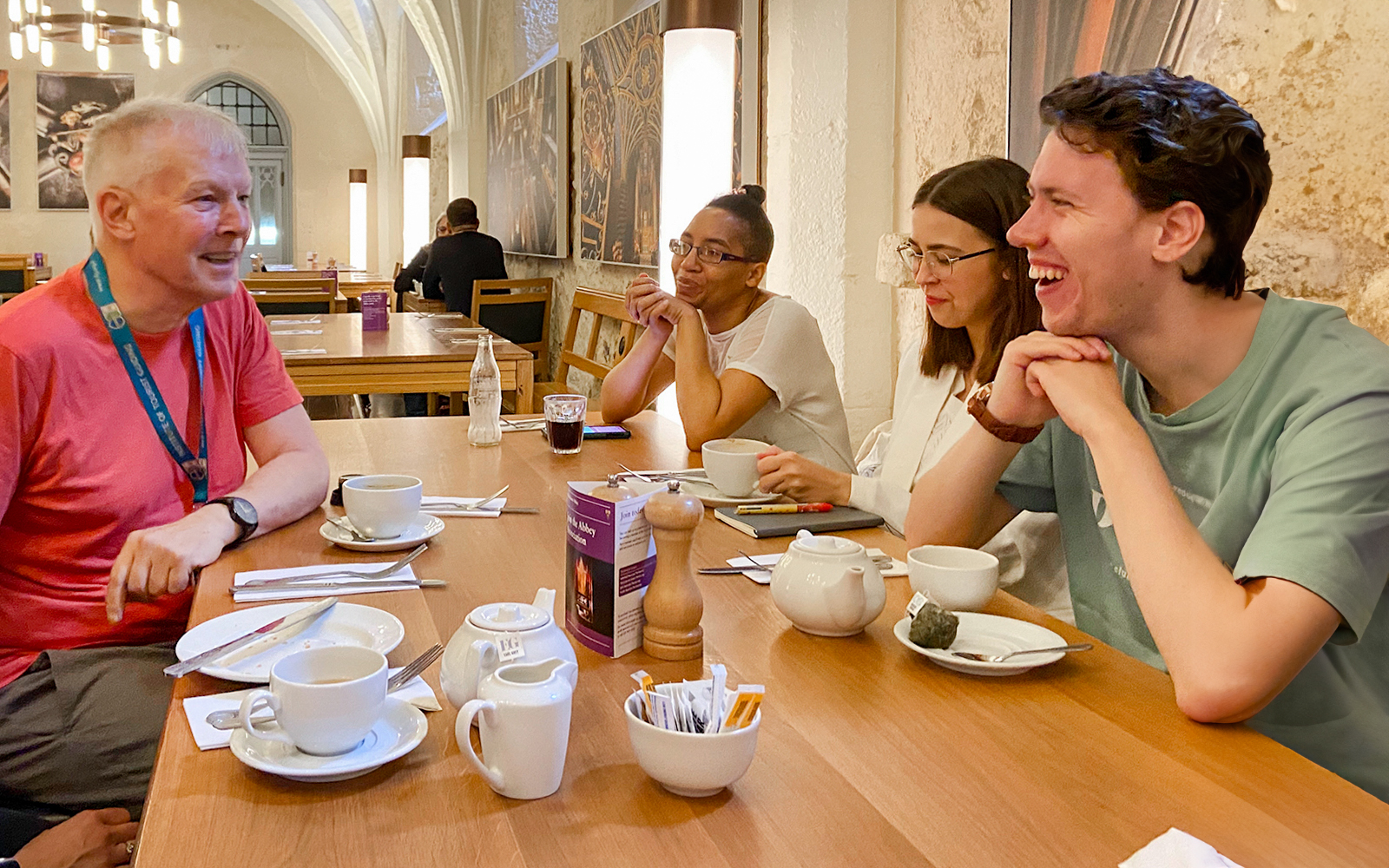 Group enjoying a discussion over tea during a private guided tour of Westminster Abbey.