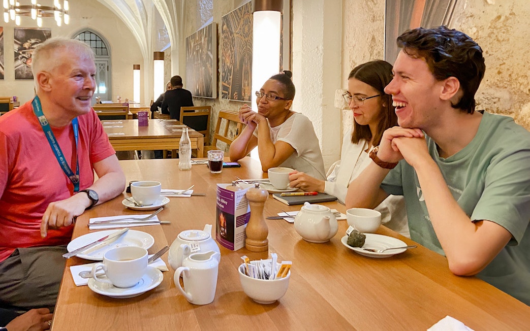 Group enjoying a discussion over tea during a private guided tour of Westminster Abbey.