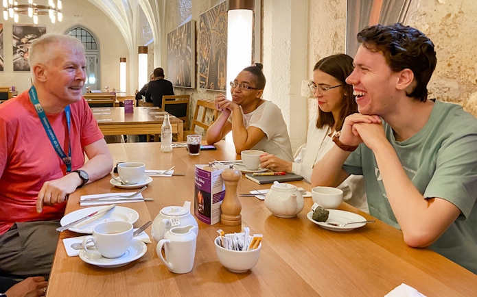Group enjoying a discussion over tea during a private guided tour of Westminster Abbey.