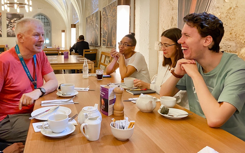 Group enjoying a discussion over tea during a private guided tour of Westminster Abbey.