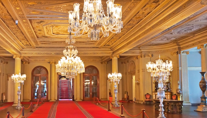 Dolmabahce Palace interior with ornate chandeliers and intricate ceiling designs in Istanbul.
