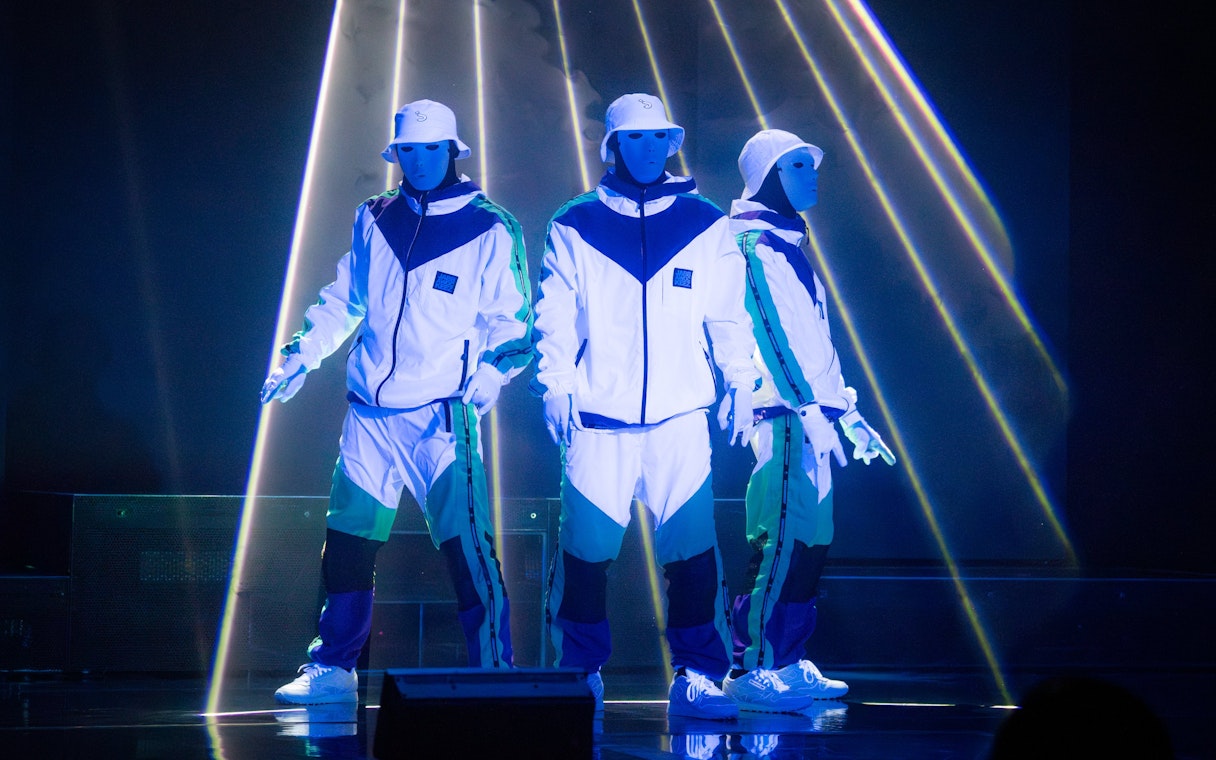 Dancers in white costumes performing at Jabbawockeez show, Las Vegas.
