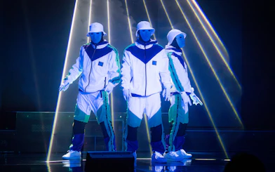 Dancers in white costumes performing at Jabbawockeez show, Las Vegas.