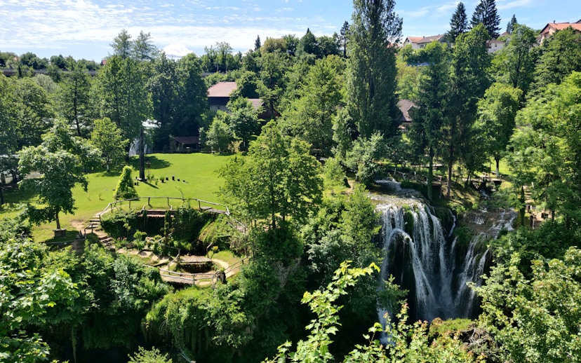 Waterfall and greenery in Rastoke Village, Croatia, part of the Plitvice Lakes tour.