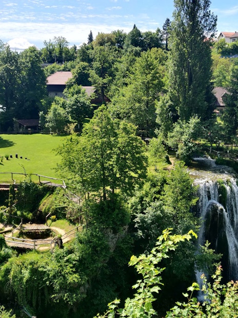 Waterfall and greenery in Rastoke Village, Croatia, part of the Plitvice Lakes tour.