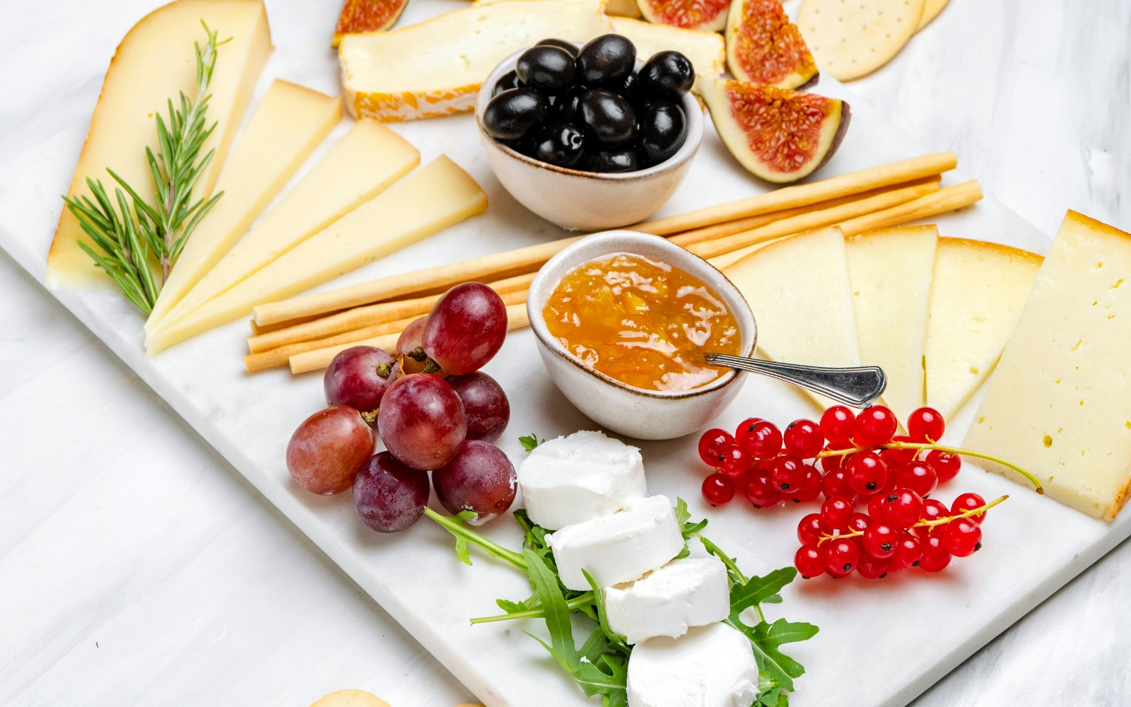 Charcuterie board with meats and cheeses at a Parisian wine tasting tour.