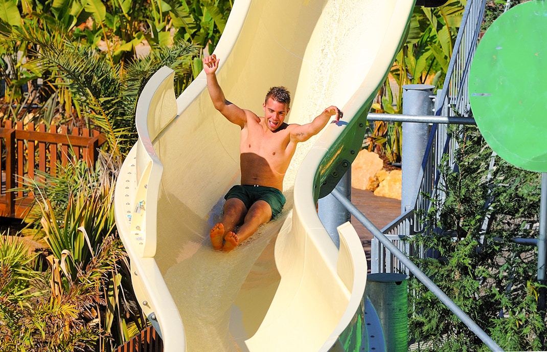 Guest sliding down water slide at Zoomarine Algarve, Portugal.