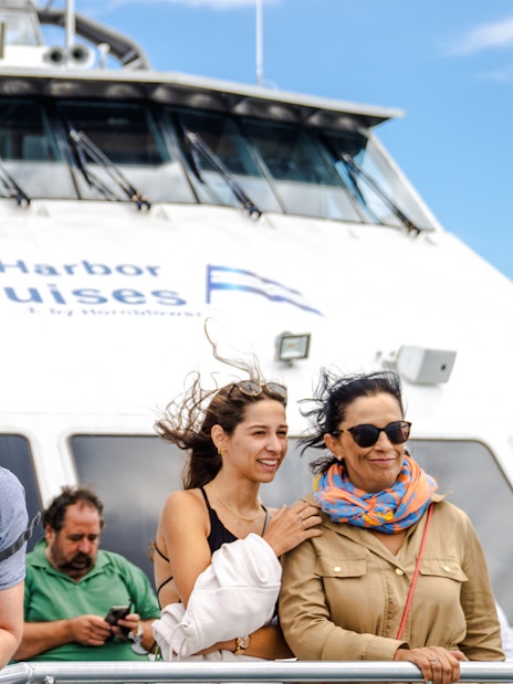 Guests enjoying a whale watching cruise on an England Aquarium tour.