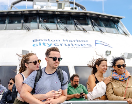 Guests observing whales from a boat on England Aquarium Whale Watching Cruise