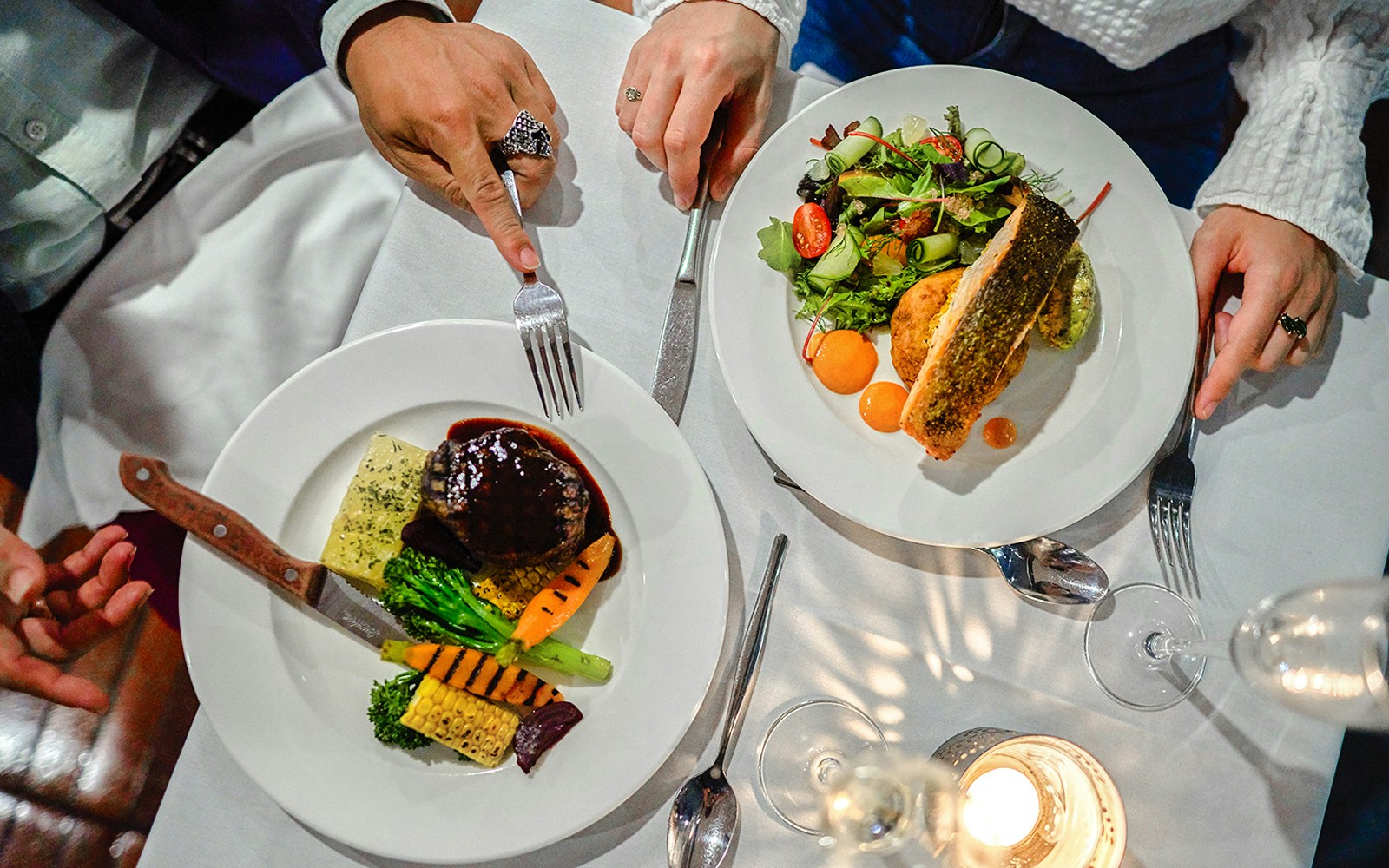 Dining on the Spirit of Melbourne Dinner Cruise with gourmet dishes and wine.
