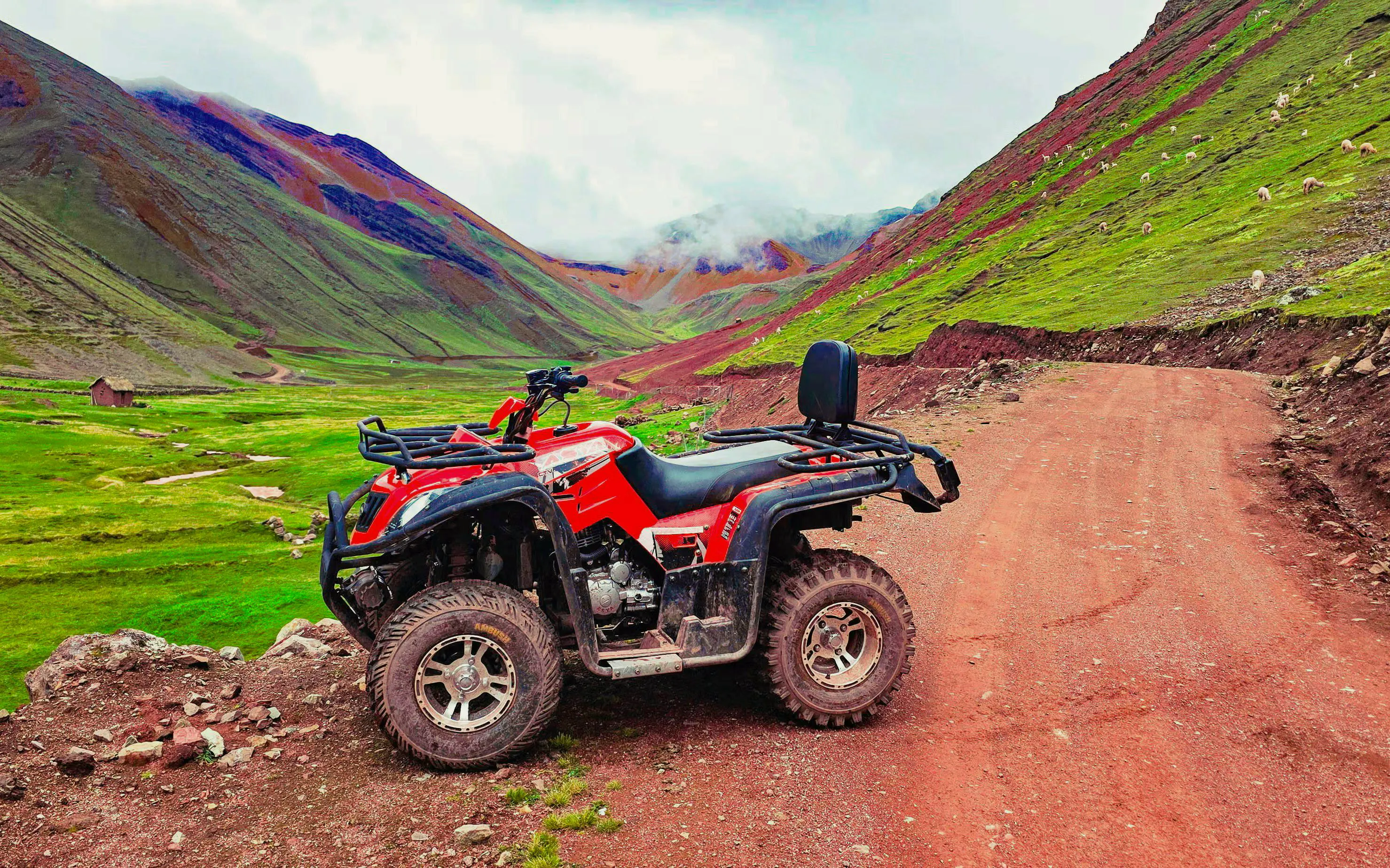ATV on a dirt path in Rainbow Mountain and Red Valley, Peru.