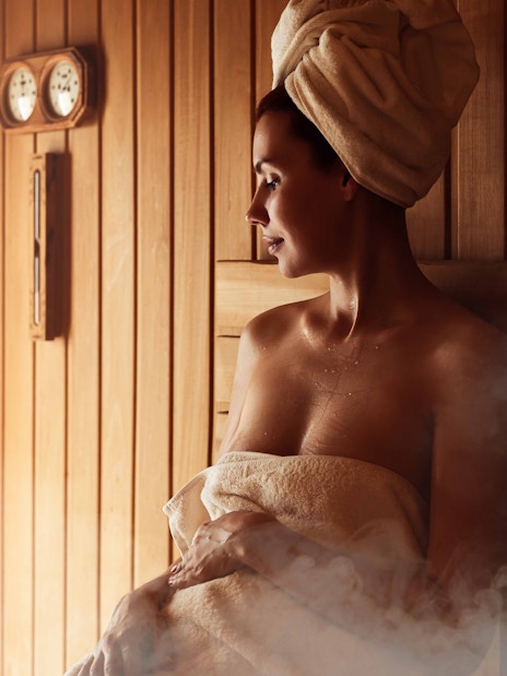 Person relaxing in a sauna at Szechenyi Thermal Spa, Budapest.