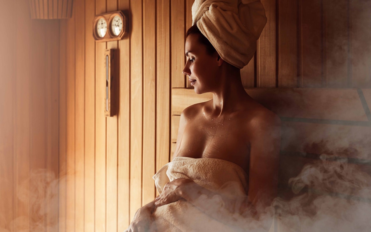 Person relaxing in a sauna at Szechenyi Thermal Spa, Budapest.