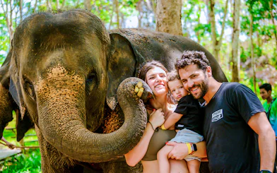 Family with elephant at Lily Elephant Camp, Phuket.