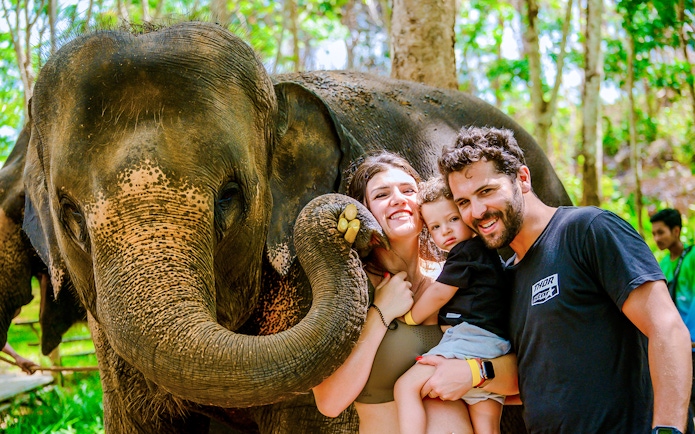 Family with elephant at Lily Elephant Camp, Phuket.