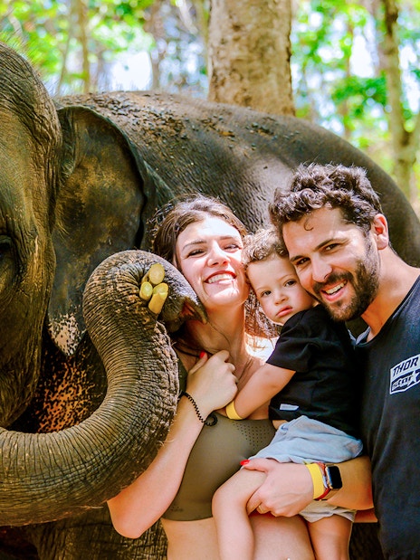 Family with elephant at Lily Elephant Camp, Phuket.