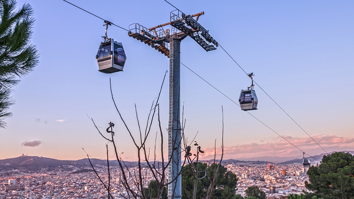 Montjuic Cable Car overlooking Barcelona cityscape and Aquarium Barcelona entrance.