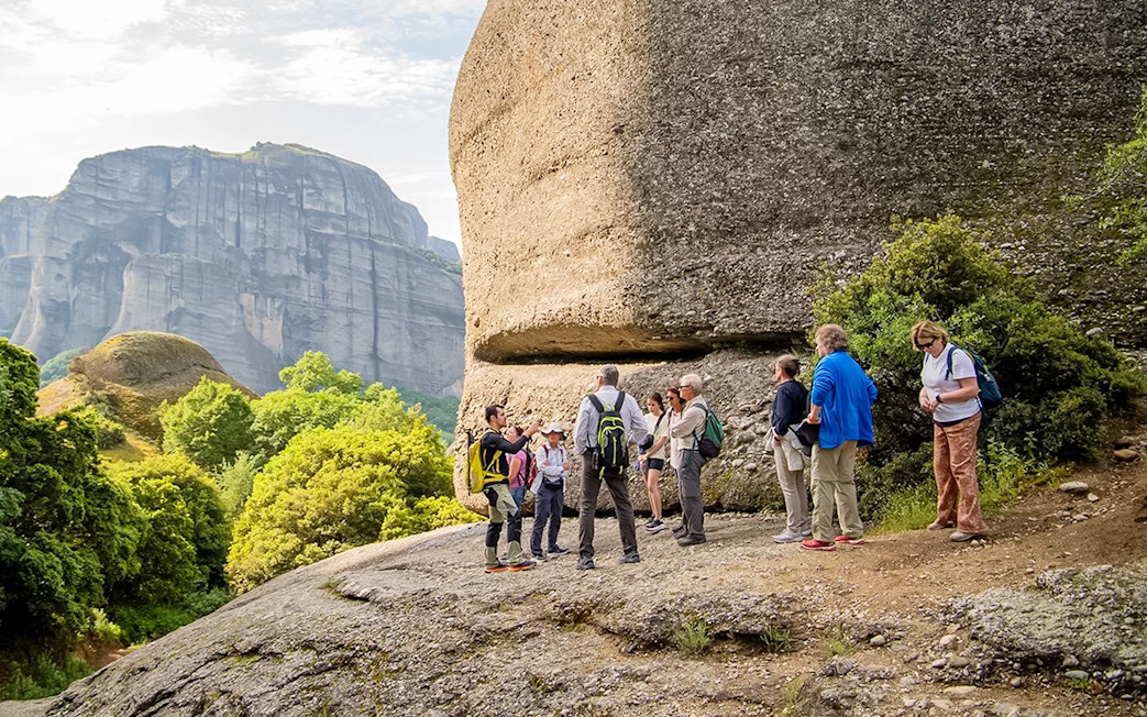 Guests hiking near rock formations during Meteora Hiking Tour with Monastery Visit.