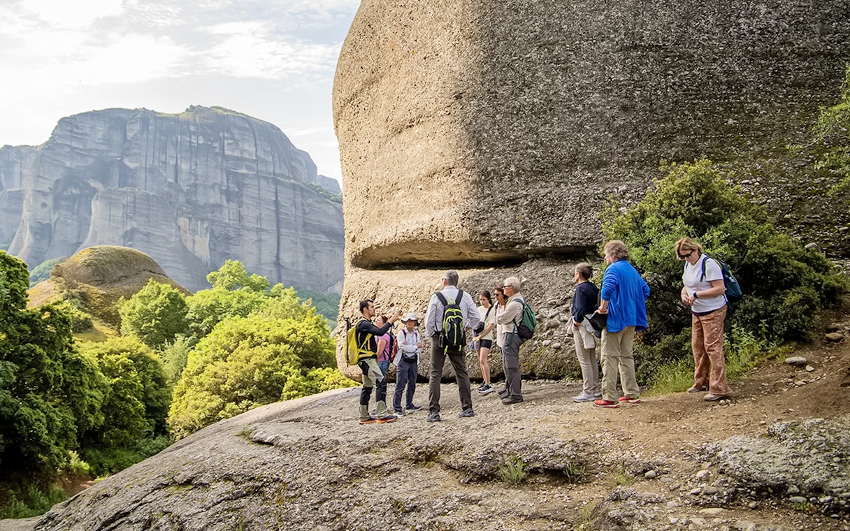Guests hiking near rock formations during Meteora Hiking Tour with Monastery Visit.