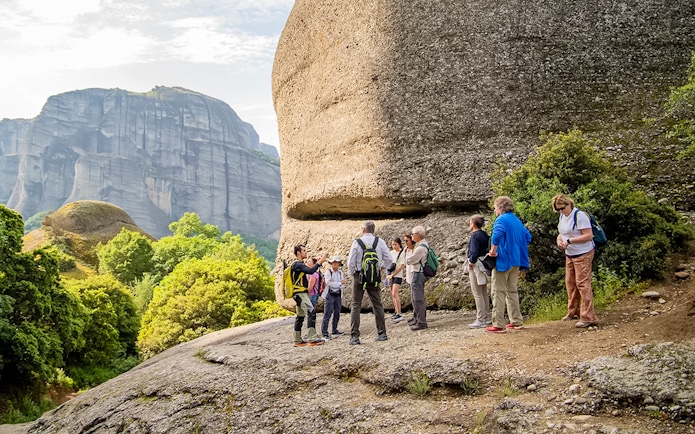 Guests hiking near rock formations during Meteora Hiking Tour with Monastery Visit.