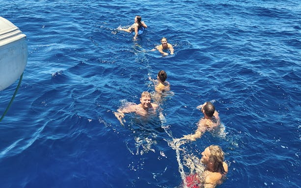 Guests swimming during Stavanger Fjord sailing tour.