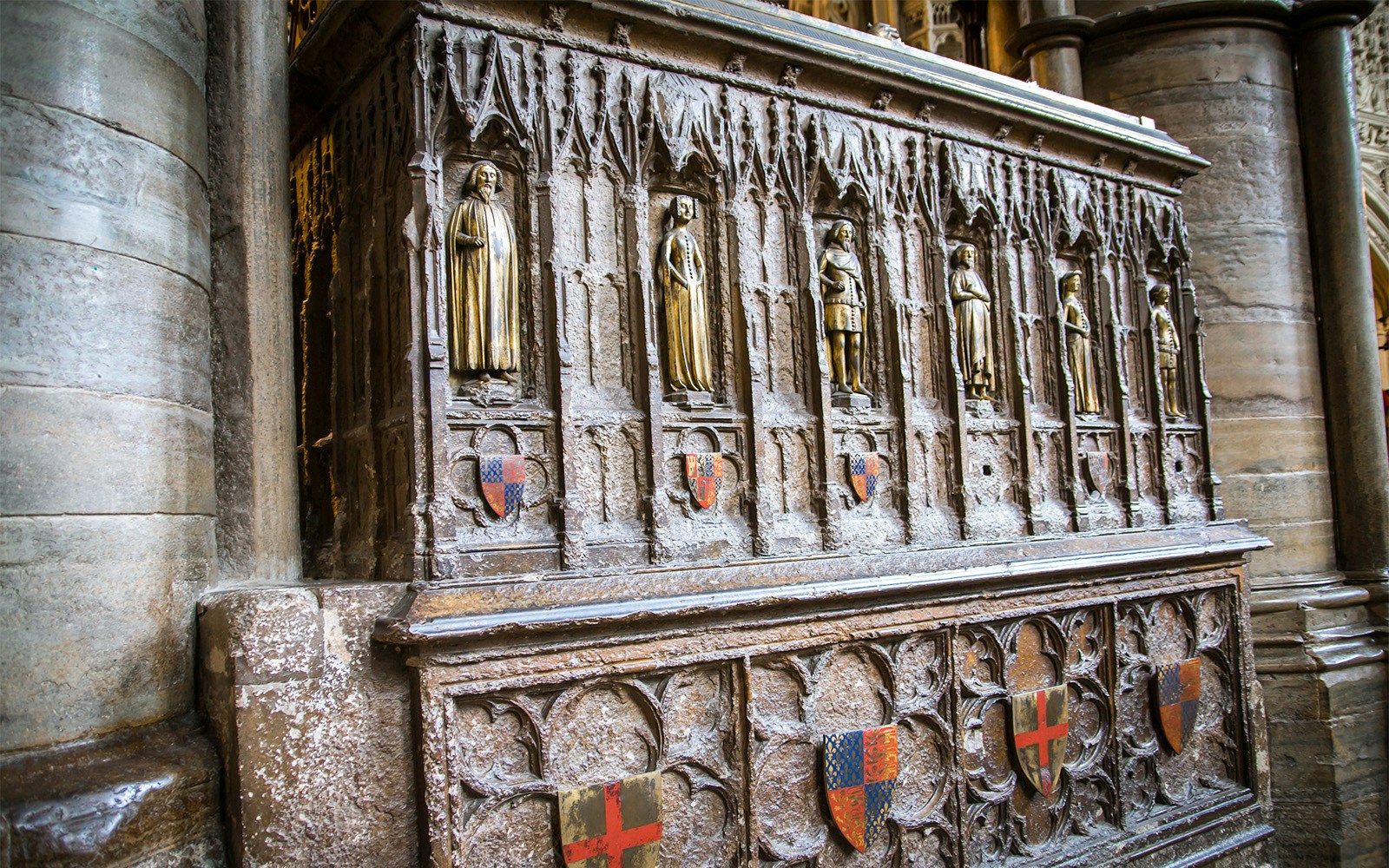 Stone carvings and shields inside Westminster Abbey, London.