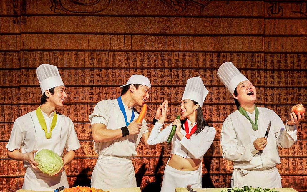 Chefs performing a cooking show with vegetables in Nice.