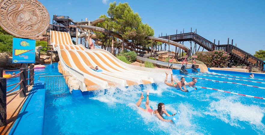 Visitors enjoying water slides at Western Water Park, Mallorca.