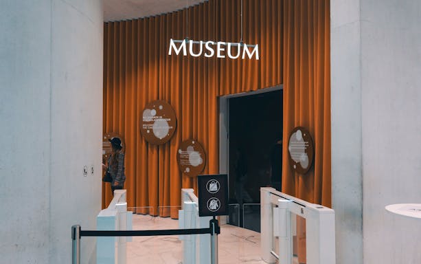 Entrance to Lindt Chocolate Museum with welcome signs and visitor.