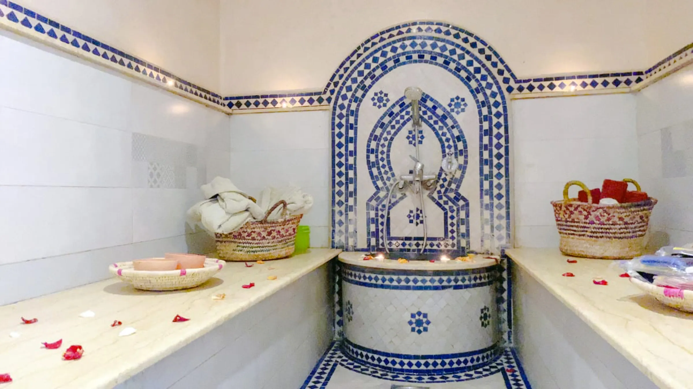 Traditional Moroccan hammam with mosaic tiles and baskets, Agadir.