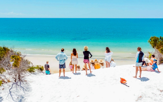 Tourists enjoying the beach view on Fraser Island, K'gari.