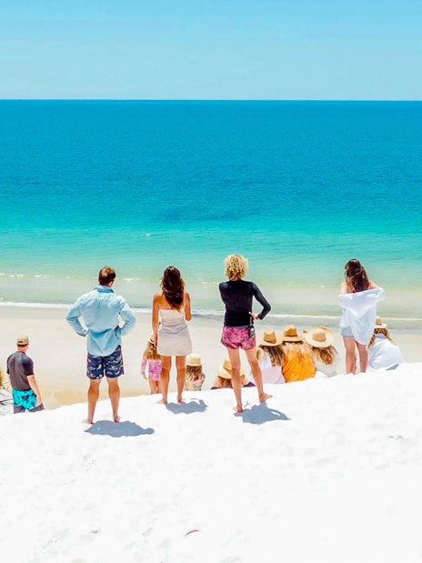 Tourists enjoying the beach view on Fraser Island, K'gari.