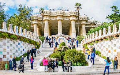 Visitors on the mosaic stairs of Park Güell, Barcelona.