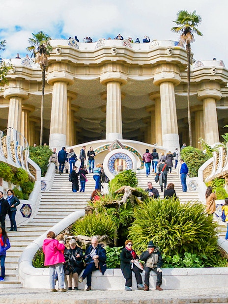 Visitors on the mosaic stairs of Park Güell, Barcelona.