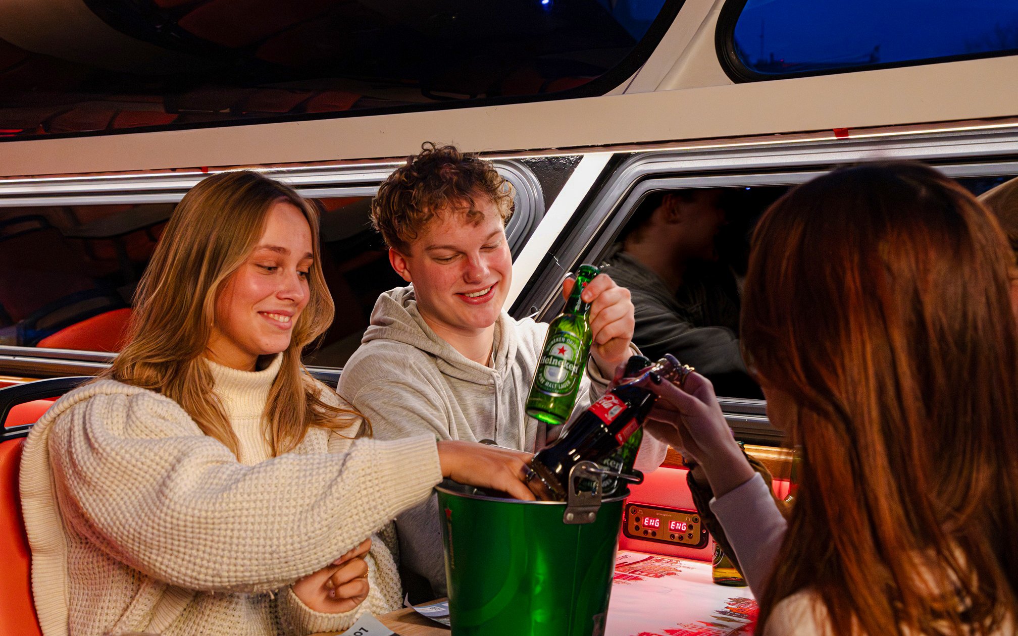 Guests enjoying drinks on the Lovers Canal Cruise in Amsterdam.